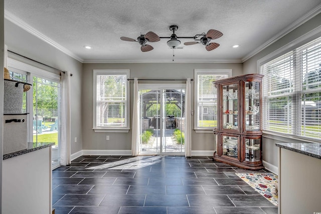 entryway featuring baseboards, a ceiling fan, crown molding, and recessed lighting