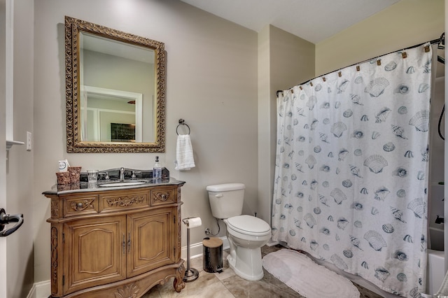 full bath featuring vanity, toilet, tile patterned floors, baseboards, and shower / tub combo