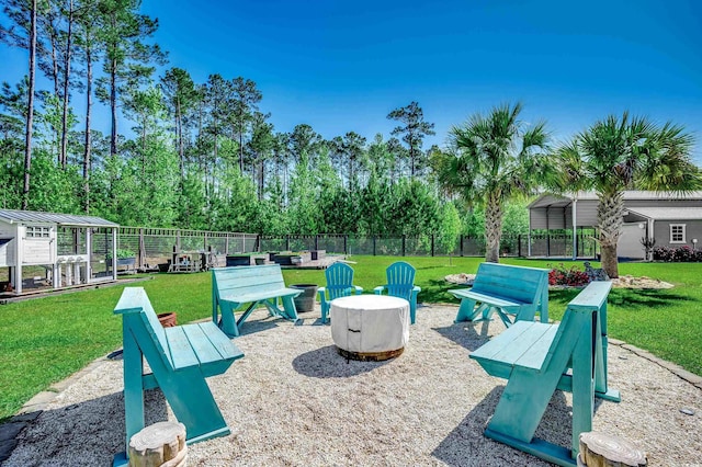 surrounding community with a lawn and fence