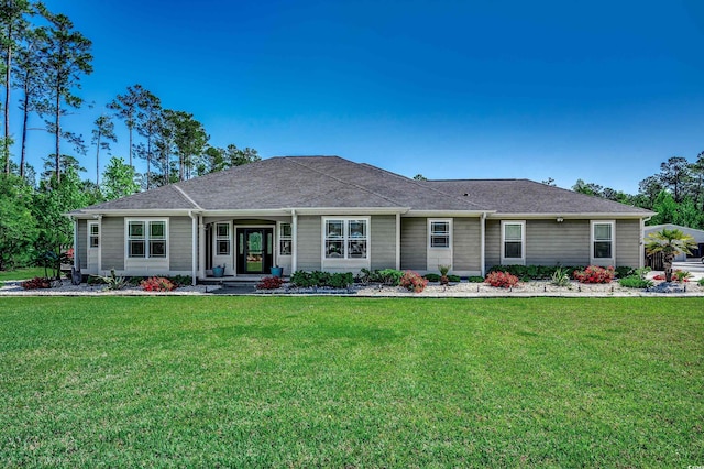 ranch-style home with a front lawn