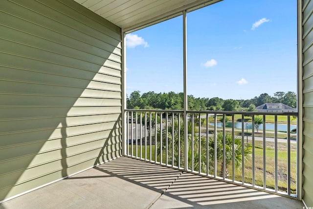 balcony with view of wooded area