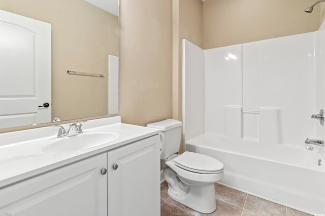 full bathroom with tile patterned flooring, toilet, vanity, and washtub / shower combination