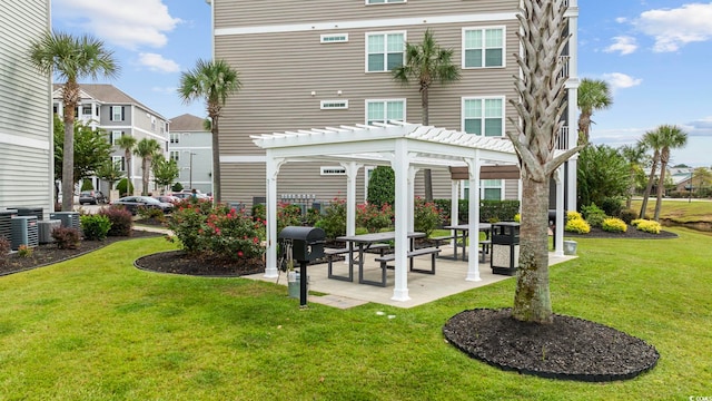back of property with a pergola, a yard, and a residential view