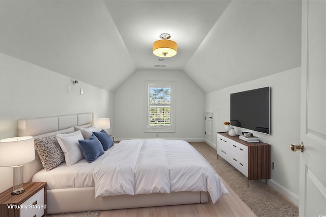 256 Shoreward Dr, Myrtle Beach, SC 29579 - carpeted bedroom with baseboards, vaulted ceiling, and visible vents