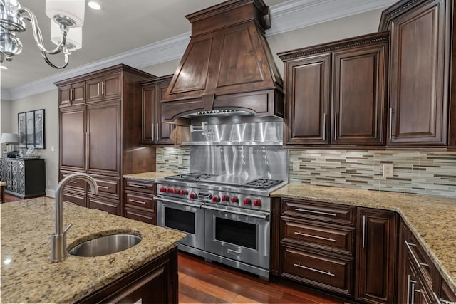 256 Shoreward Dr, Myrtle Beach, SC 29579 - kitchen with range with two ovens, a sink, a notable chandelier, ornamental molding, and custom range hood