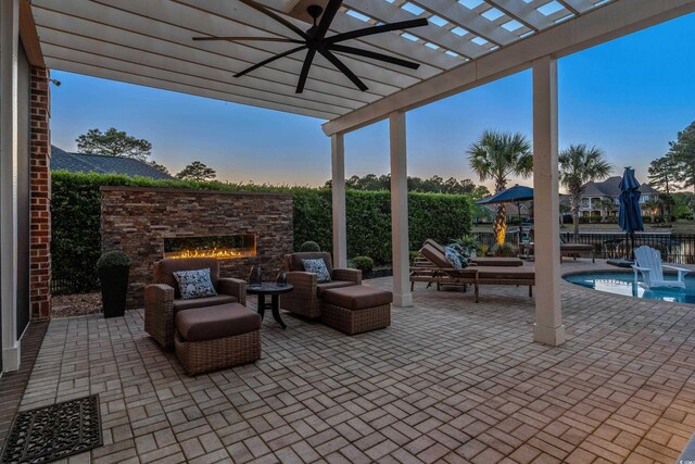 256 Shoreward Dr, Myrtle Beach, SC 29579 - view of patio with an outdoor stone fireplace, a ceiling fan, and a pergola