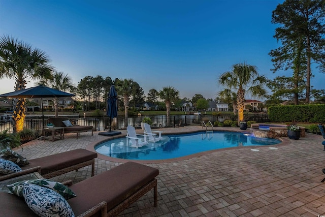 256 Shoreward Dr, Myrtle Beach, SC 29579 - view of pool featuring fence, a patio, a water view, and a pool with connected hot tub
