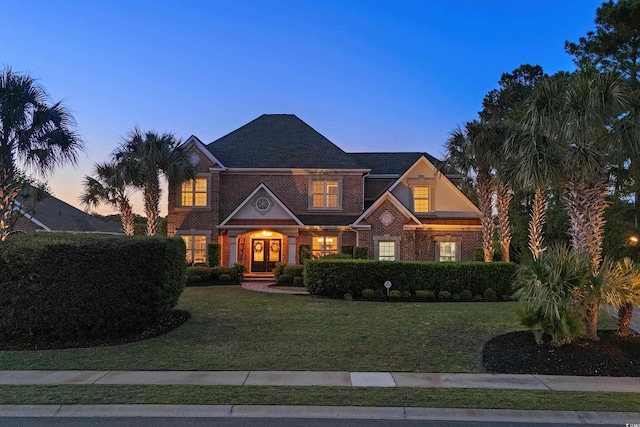256 Shoreward Dr, Myrtle Beach, SC 29579 - view of front facade featuring brick siding and a yard
