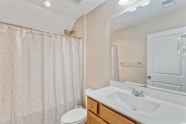 2446 Craven Dr, Myrtle Beach, SC 29572 - bathroom featuring vanity, vaulted ceiling, toilet, and visible vents