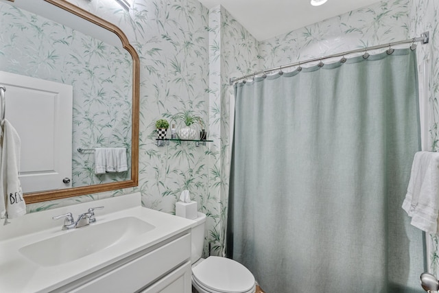 2446 Craven Dr, Myrtle Beach, SC 29572 - bathroom with a shower with curtain, vanity, toilet, and wallpapered walls