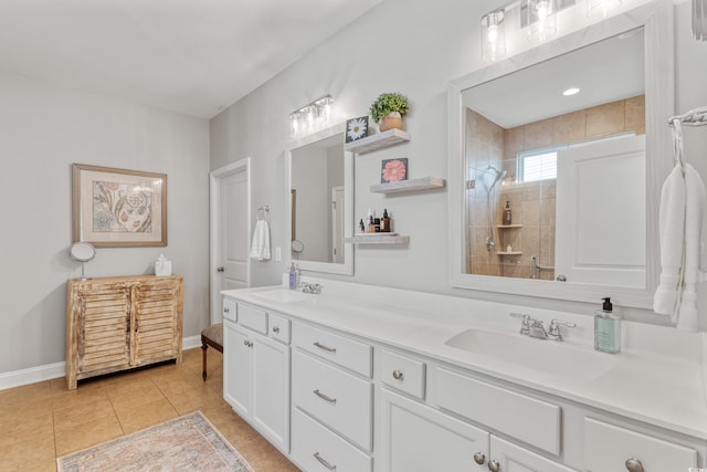 2446 Craven Dr, Myrtle Beach, SC 29572 - bathroom featuring double vanity, a tile shower, a sink, and tile patterned flooring