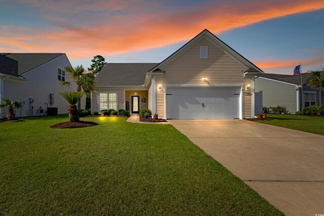 2446 Craven Dr, Myrtle Beach, SC 29572 - traditional-style house with central AC unit, an attached garage, driveway, and a front yard