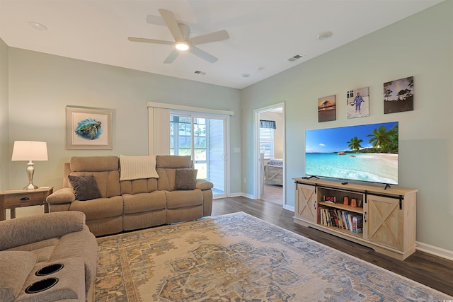 living area with baseboards, a ceiling fan, dark wood-style floors, and visible vents