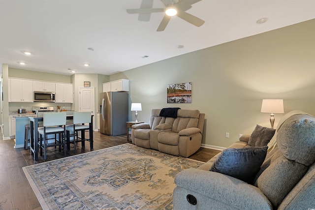 living area featuring baseboards, recessed lighting, dark wood finished floors, and ceiling fan