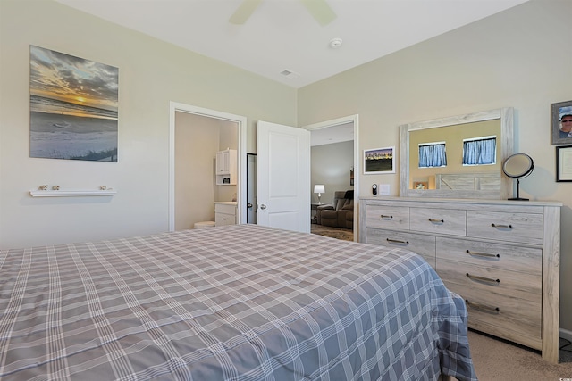bedroom with visible vents, a ceiling fan, carpet, and connected bathroom