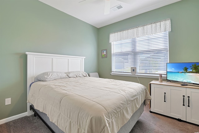 bedroom with a ceiling fan, baseboards, visible vents, and carpet
