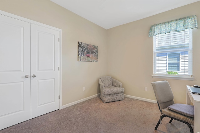 carpeted home office with baseboards