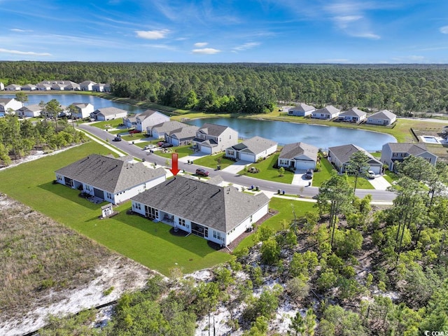 aerial view featuring a water view and a wooded view