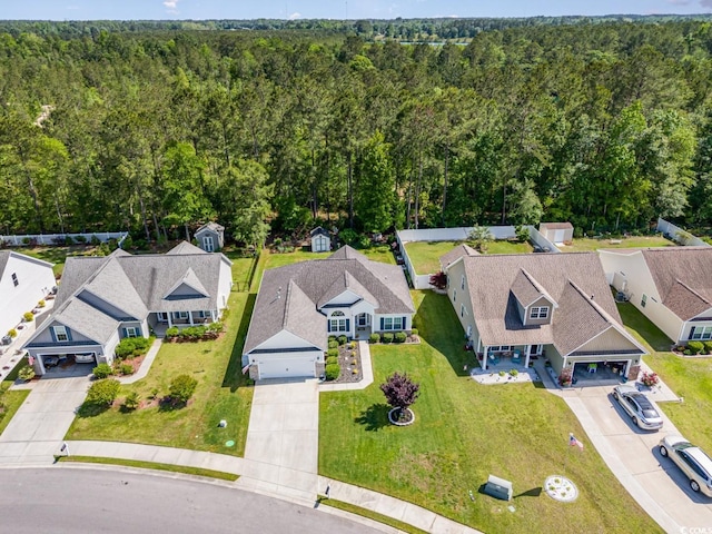 birds eye view of property with a residential view and a wooded view