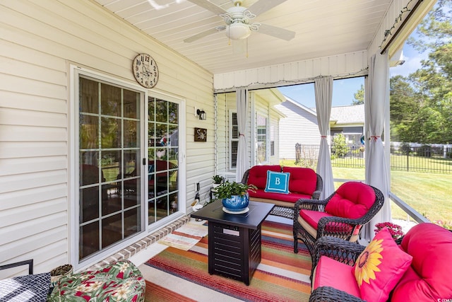 sunroom / solarium featuring an outdoor hangout area and a ceiling fan