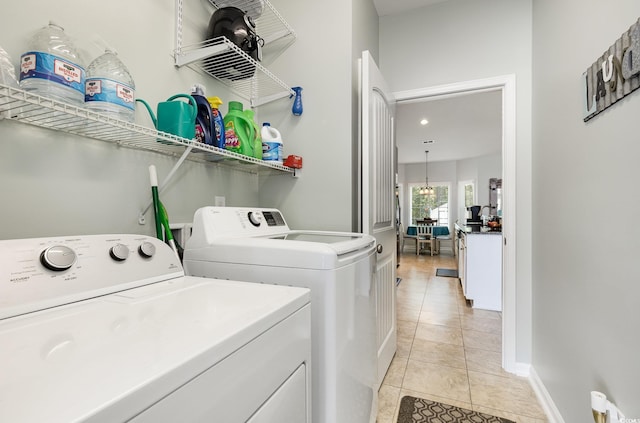 laundry room with laundry area, recessed lighting, light tile patterned floors, and washer and dryer
