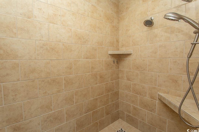 full bath featuring tiled shower