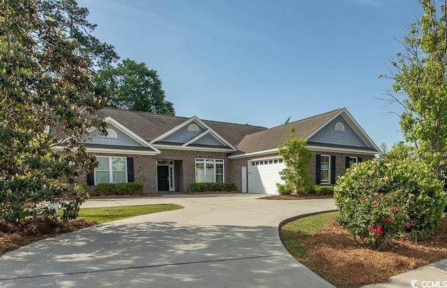 view of front of house featuring a garage and concrete driveway