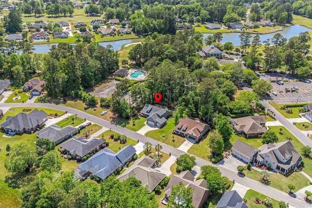 drone / aerial view featuring a water view and a residential view