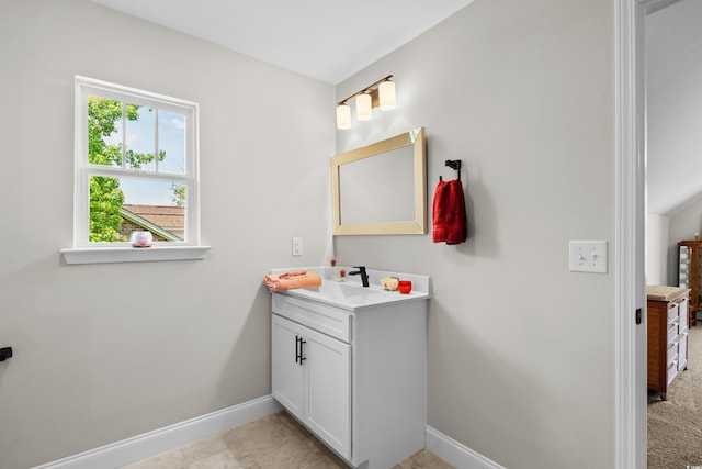 bathroom with baseboards and vanity