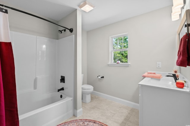 bathroom featuring toilet, shower / washtub combination, tile patterned floors, baseboards, and vanity