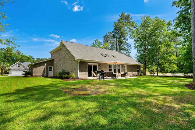 back of house featuring an outdoor hangout area, a patio, brick siding, and a lawn