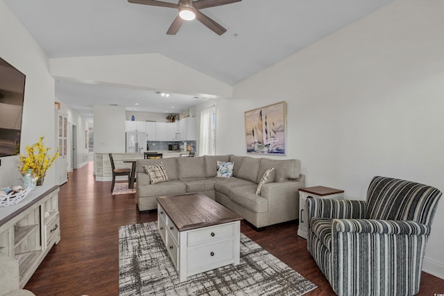 living area featuring baseboards, ceiling fan, lofted ceiling, and dark wood-style floors