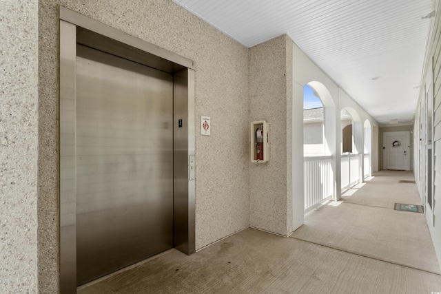hallway featuring elevator