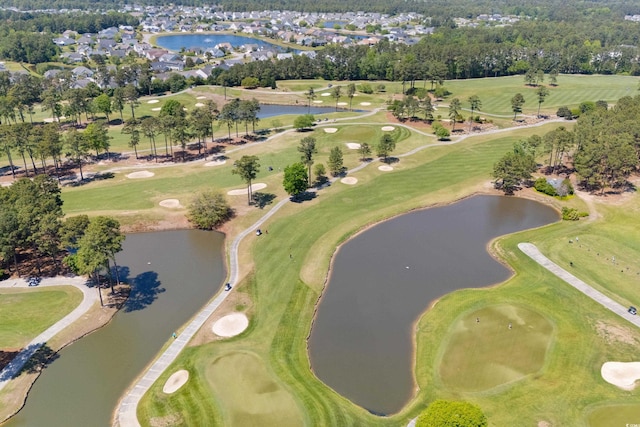 birds eye view of property featuring a water view and golf course view