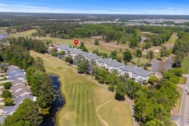 birds eye view of property featuring a water view, view of golf course, and a residential view