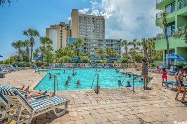 community pool with a patio