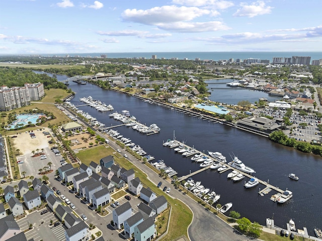 drone / aerial view featuring a water view and a city view