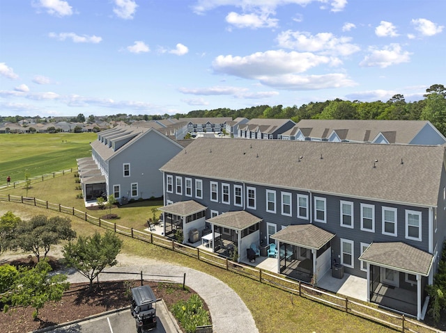 birds eye view of property with a residential view