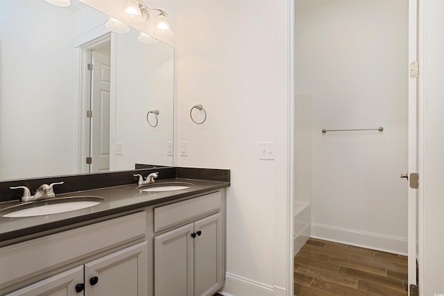 1359 Peterson St, Myrtle Beach, SC 29577 - full bath with wood finished floors, double vanity, and baseboards