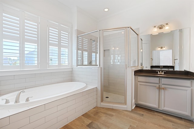 1359 Peterson St, Myrtle Beach, SC 29577 - bathroom with a stall shower, a garden tub, crown molding, wood finished floors, and vanity