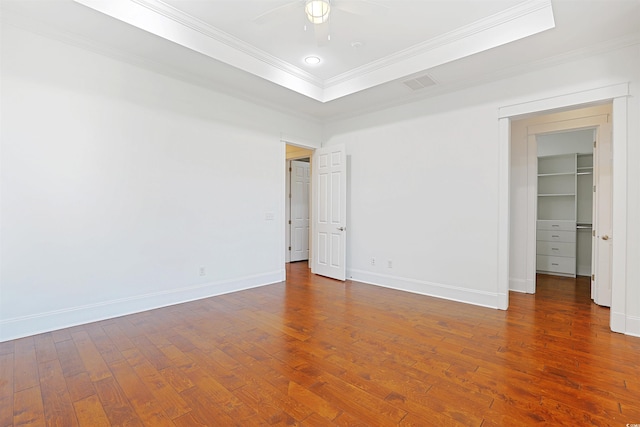 1359 Peterson St, Myrtle Beach, SC 29577 - unfurnished bedroom featuring hardwood / wood-style flooring, crown molding, a walk in closet, baseboards, and a closet