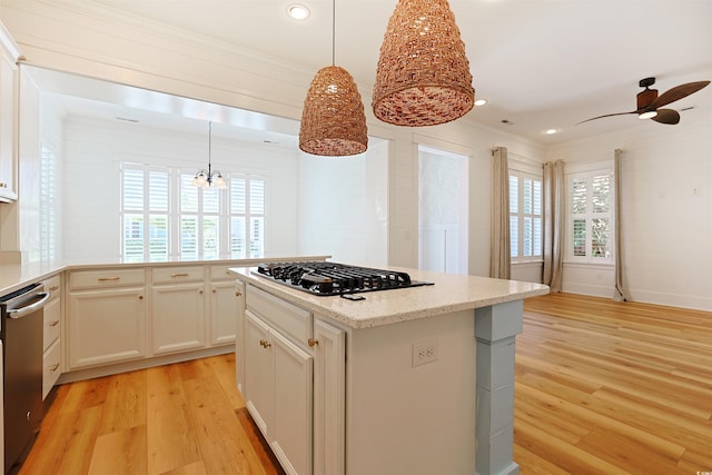 1359 Peterson St, Myrtle Beach, SC 29577 - kitchen with stainless steel dishwasher, a chandelier, light wood-style floors, gas cooktop, and white cabinetry
