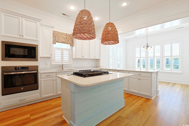 1359 Peterson St, Myrtle Beach, SC 29577 - kitchen with oven, built in microwave, a peninsula, black gas cooktop, and a kitchen island
