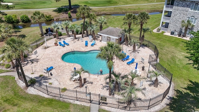 4771 Wild Iris Dr Unit 103, Myrtle Beach, SC 29577 - exterior space featuring a lawn, a water view, fence, and a patio area