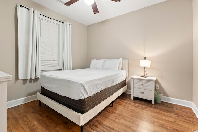 4771 Wild Iris Dr Unit 103, Myrtle Beach, SC 29577 - bedroom with baseboards, ceiling fan, and wood finished floors