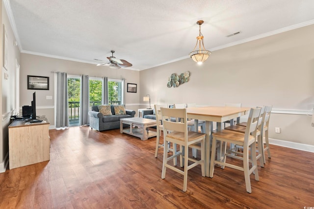 4771 Wild Iris Dr Unit 103, Myrtle Beach, SC 29577 - dining room featuring visible vents, ornamental molding, ceiling fan, and wood finished floors