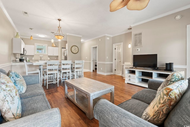 4771 Wild Iris Dr Unit 103, Myrtle Beach, SC 29577 - living room with ceiling fan, visible vents, ornamental molding, and wood finished floors