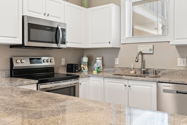 4771 Wild Iris Dr Unit 103, Myrtle Beach, SC 29577 - kitchen with a sink, appliances with stainless steel finishes, and white cabinetry