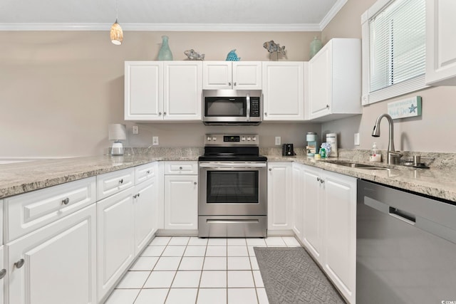 4771 Wild Iris Dr Unit 103, Myrtle Beach, SC 29577 - kitchen with white cabinetry, appliances with stainless steel finishes, ornamental molding, and a sink