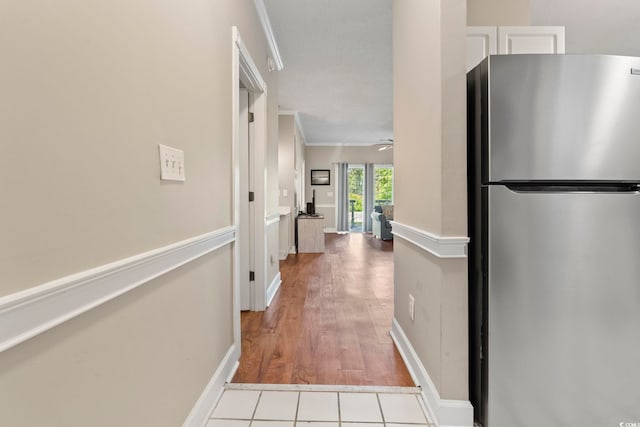 4771 Wild Iris Dr Unit 103, Myrtle Beach, SC 29577 - hallway with crown molding, baseboards, and light wood finished floors